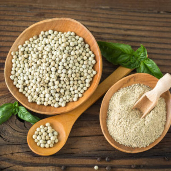 White pepper in the wooden bowl